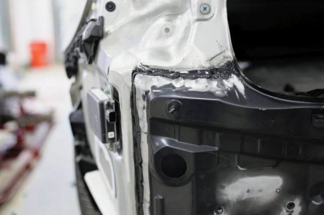 a vehicle during Bumper repair at Heritage Collision MI with bumper all torn off a-vehicle-during-Bumper-repair-at-Heritage-Collision-MI-with-bumper-all-torn-off